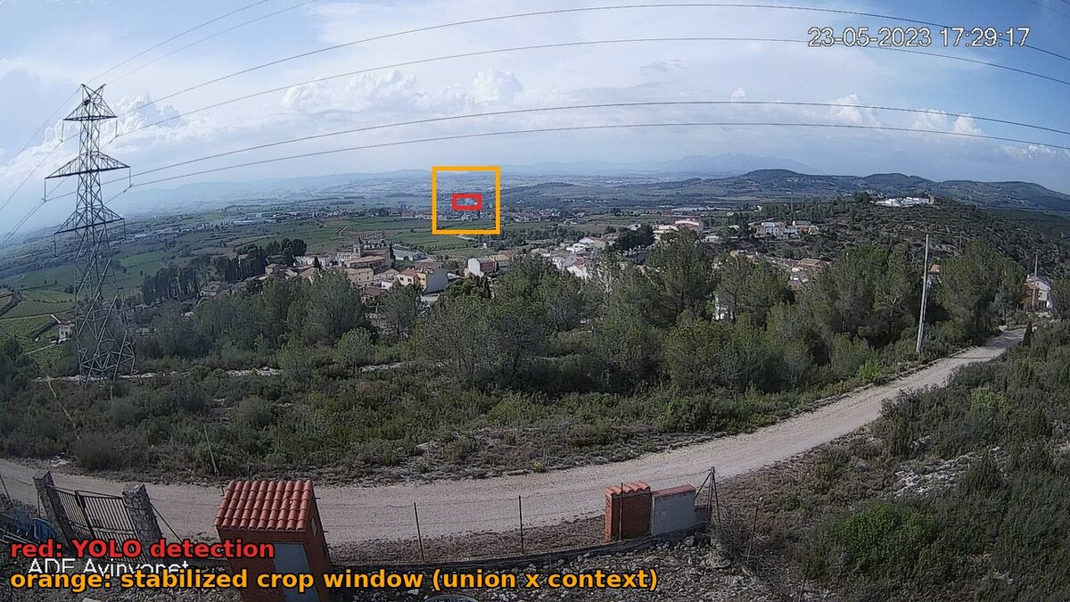 A nearly invisible distant smoke plume in a full camera frame, with detection and crop windows marked